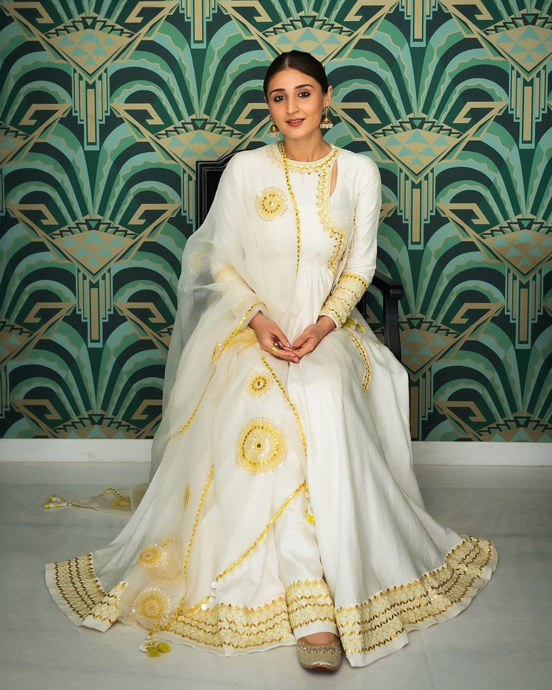 DHVANI BHANUSHALI IN IVORY ANGRAKHAA SET