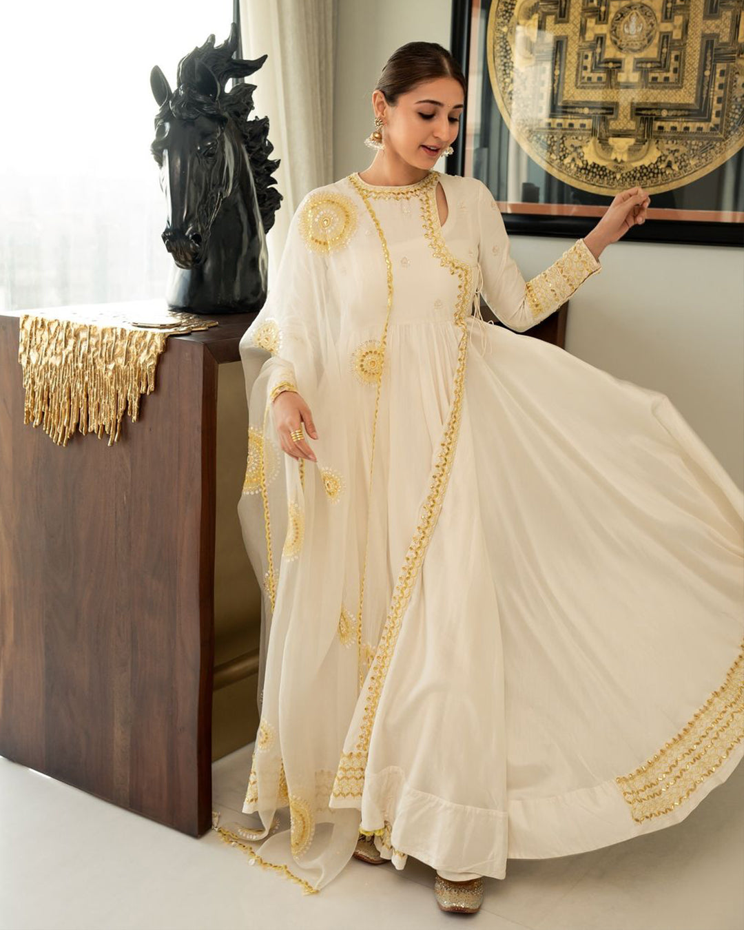 DHVANI BHANUSHALI IN IVORY ANGRAKHAA SET