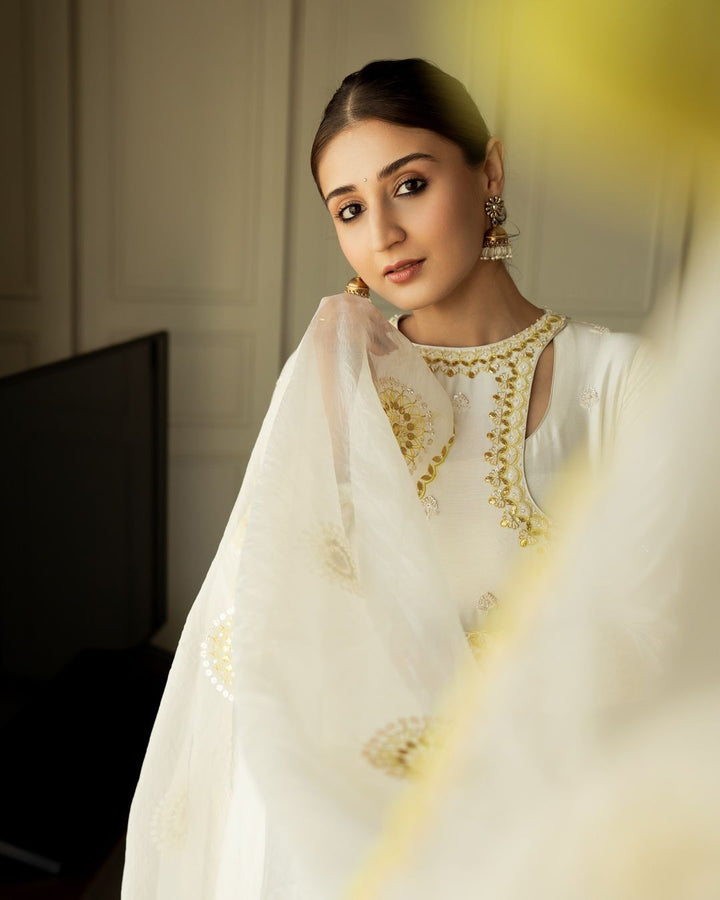 DHVANI BHANUSHALI IN IVORY ANGRAKHAA SET
