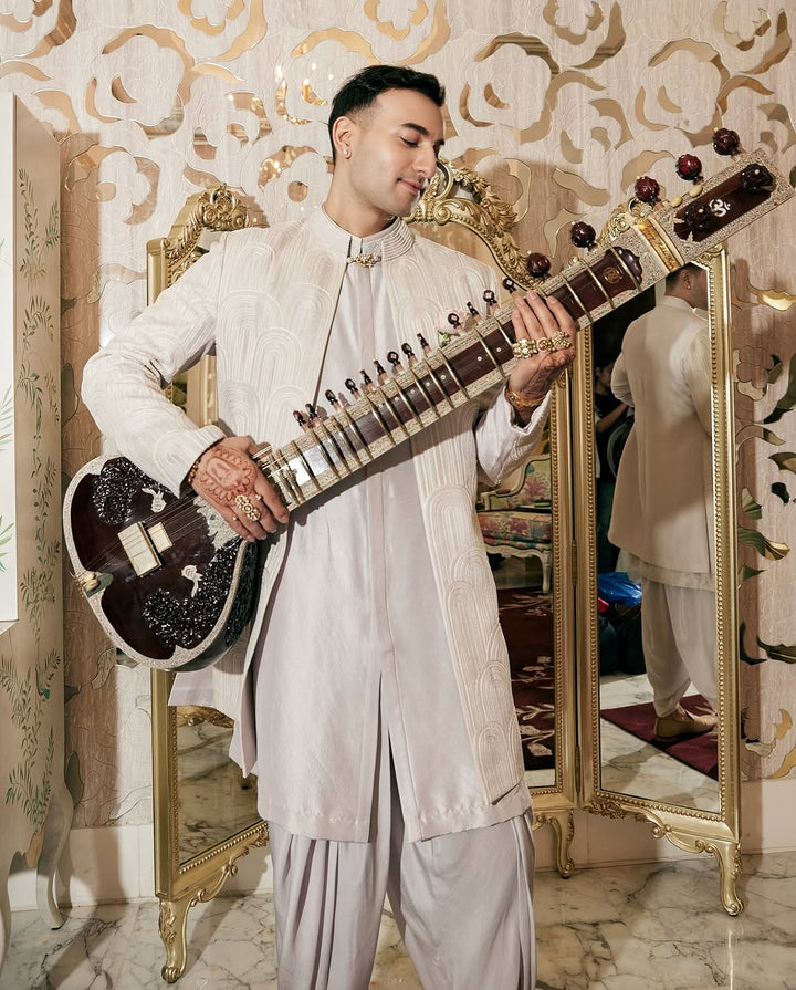 Rishabh Rikhiram Sharma In a Madzin open sherwani over a silk kurta and dhoti