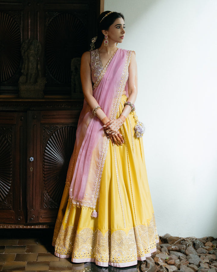 Aarti Ravi in hand-embroidered ochre lehenga set